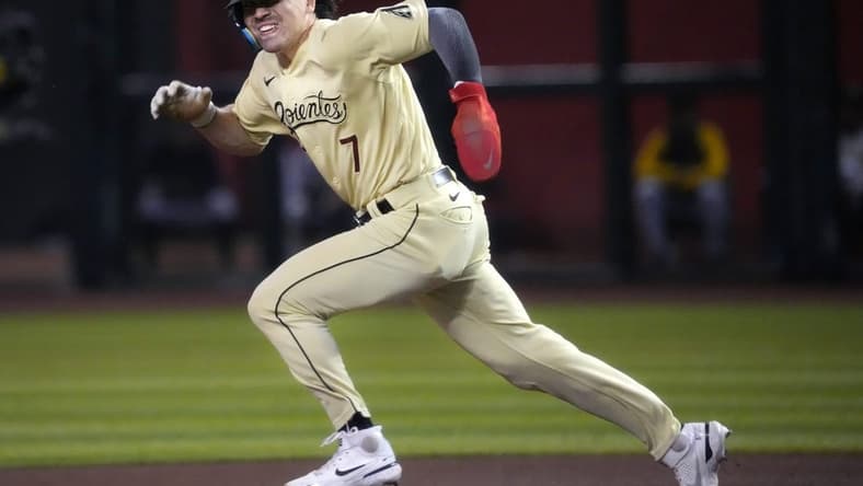 Arizona Diamondbacks Corbin Carroll (7) steals second base against the Pittsburgh Pirates at Chase Field in Phoenix on July 7, 2023.