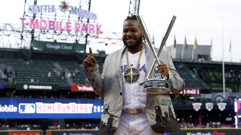 Jul 10, 2023; Seattle, Washington, USA; Toronto Blue Jays first baseman Vladimir Guerrero Jr. (27) celebrates after winning the All-Star Home Run Derby at T-Mobile Park. Mandatory Credit: Joe Nicholson-USA TODAY Sports