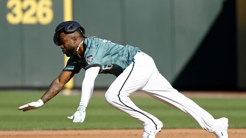 Jul 11, 2023; Seattle, Washington, USA; American League left fielder Randy Arozarena of the Tampa Bay Rays (56) attempts to steal second base during the first inning of the 2023 MLB All Star Game at T-Mobile Park. Mandatory Credit: Joe Nicholson-USA TODAY Sports