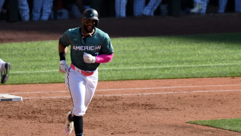 Jul 11, 2023; Seattle, Washington, USA; American League first baseman Yandy Diaz of the Tampa Bay Rays (2) reacts after hitting a home run during the second inning against the National Team at T-Mobile Park. Mandatory Credit: Steven Bisig-USA TODAY Sports