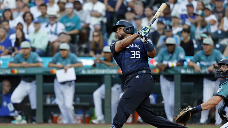 Jul 11, 2023; Seattle, Washington, USA; National League catcher Elias DIaz of the Colorado Rockies (35) hits a two-run home run against the American League during the eighth inning of the 2023 MLB All Star Game at T-Mobile Park. Mandatory Credit: Joe Nicholson-USA TODAY Sports