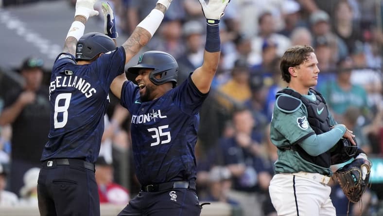 Jul 11, 2023; Seattle, Washington, USA; National League catcher Elias Diaz of the Colorado Rockies (35) reacts after hitting a two run home run against the American League during the eighth inning at T-Mobile Park. Mandatory Credit: Stephen Brashear-USA TODAY Sports