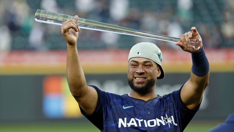 Jul 11, 2023; Seattle, Washington, USA; National League catcher Elias DIaz of the Colorado Rockies (35) holds up the MVP trophy after winning the 2023 MLB All Star Game at T-Mobile Park. Mandatory Credit: Joe Nicholson-USA TODAY Sports