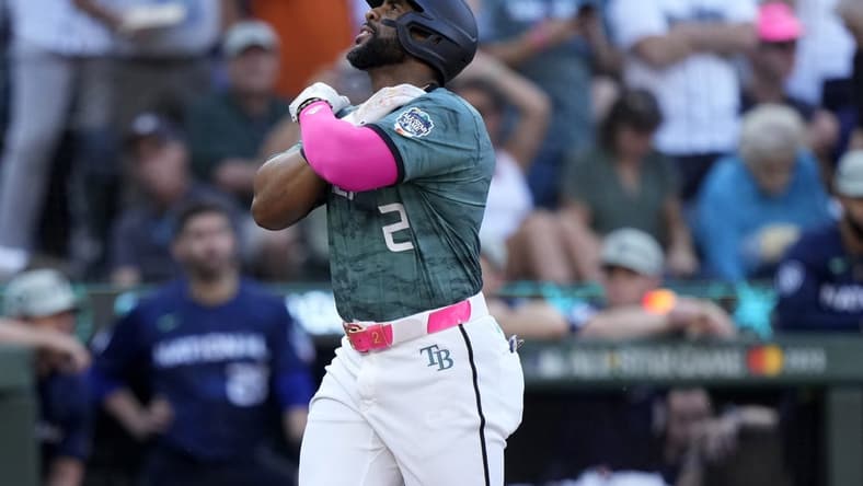Jul 11, 2023; Seattle, Washington, USA; American League first baseman Yandy Diaz of the Tampa Bay Rays (2) reacts after hitting a home run during the second inning at T-Mobile Park. Mandatory Credit: Stephen Brashear-USA TODAY Sports