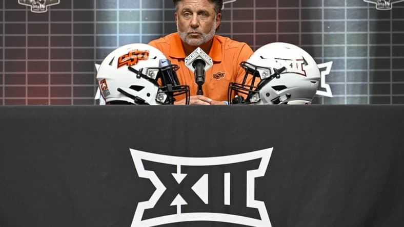 Jul 12, 2023; Arlington, TX, USA; Oklahoma State head coach Mike Gundy is interviewed during Big 12 football media day at AT&T Stadium. Mandatory Credit: Jerome Miron-USA TODAY Sports