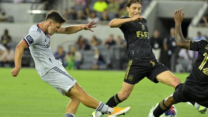 Jul 12, 2023; Los Angeles, California, USA;  Los Angeles FC midfielder Ilie Sanchez (6) defends a shot on goal by St. Louis City forward Tomas Ostrak (7) in the first half at BMO Stadium. Mandatory Credit: Jayne Kamin-Oncea-USA TODAY Sports
