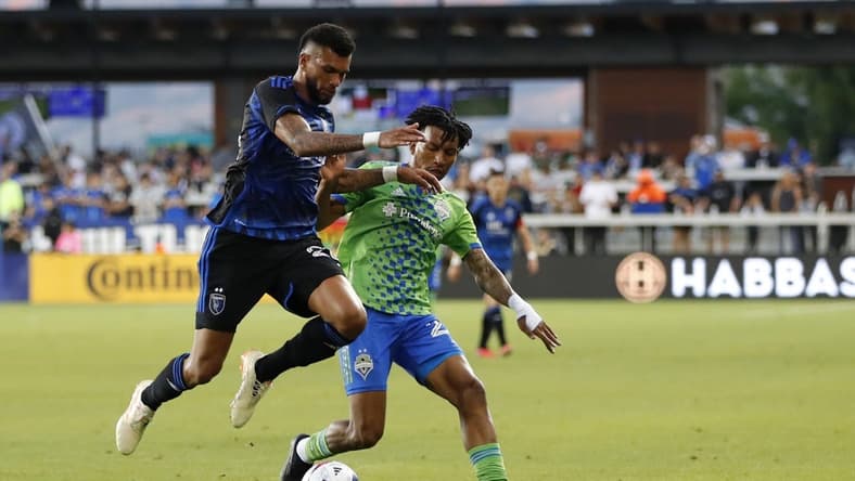 Jul 12, 2023; San Jose, California, USA; San Jose Earthquakes defender Rodrigues (26) and Seattle Sounders midfielder Leo Chu (23) battle for the ball during the first half at PayPal Park. Mandatory Credit: John Hefti-USA TODAY Sports