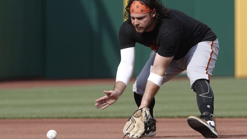 Jul 14, 2023; Pittsburgh, Pennsylvania, USA; San Francisco Giants shortstop Brandon Crawford warms up before the game against the Pittsburgh Pirates at PNC Park. Mandatory Credit: Charles LeClaire-USA TODAY Sports