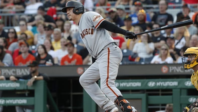 Jul 14, 2023; Pittsburgh, Pennsylvania, USA; San Francisco Giants first baseman Wilmer Flores (41) hits a single against the Pittsburgh Pirates during the third inning at PNC Park. Mandatory Credit: Charles LeClaire-USA TODAY Sports