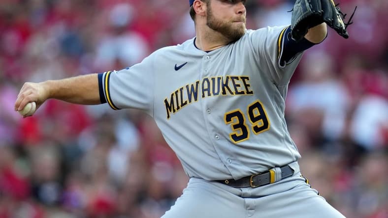 Milwaukee Brewers starting pitcher Corbin Burnes (39) delivers in the first inning during a baseball game between the Milwaukee Brewers and the Cincinnati Reds, Friday, July 14, 2023, at Great American Ball Park in Cincinnati.