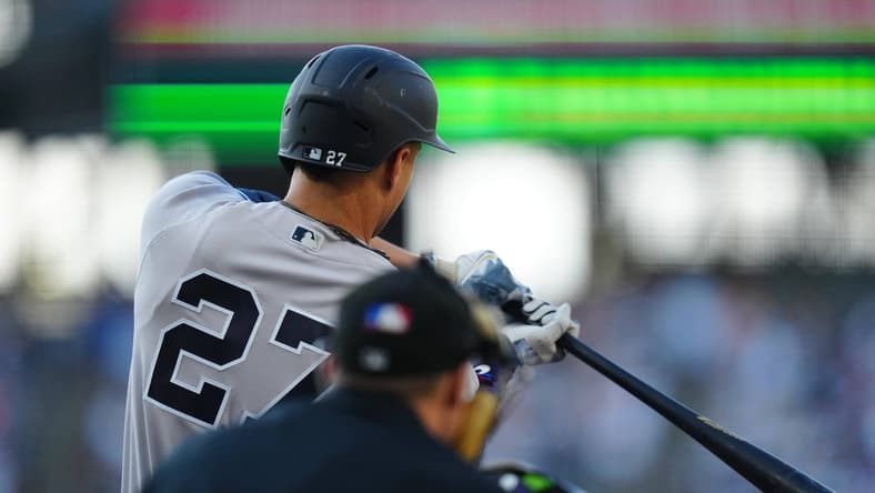 Jul 14, 2023; Denver, Colorado, USA; New York Yankees right fielder Giancarlo Stanton (27) hits a two run home run in the first inning against the Colorado Rockies at Coors Field. Mandatory Credit: Ron Chenoy-USA TODAY Sports