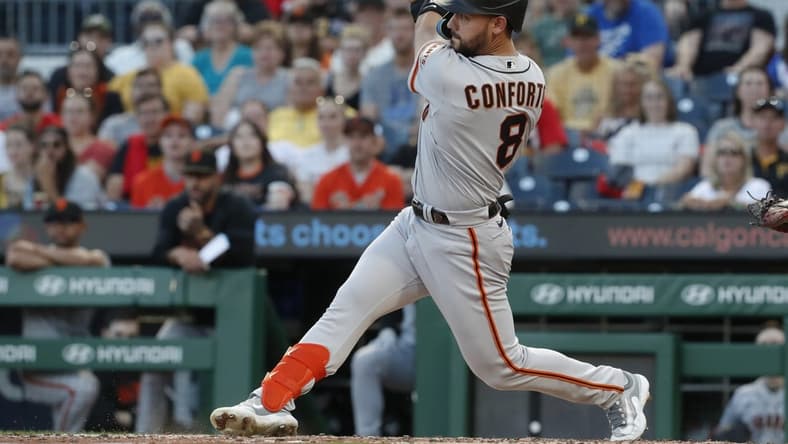 Jul 14, 2023; Pittsburgh, Pennsylvania, USA; San Francisco Giants right fielder Michael Conforto (8) hits a two run single against the Pittsburgh Pirates during the fifth inning at PNC Park. Mandatory Credit: Charles LeClaire-USA TODAY Sports