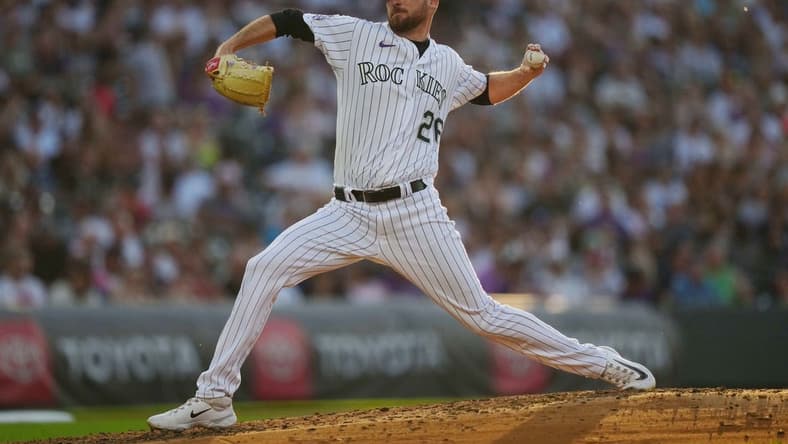 Jul 14, 2023; Denver, Colorado, USA; Colorado Rockies starting pitcher Austin Gomber (26) pitches in fourth inning against the New York Yankees at Coors Field. Mandatory Credit: Ron Chenoy-USA TODAY Sports