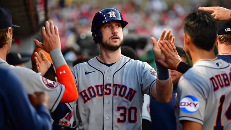 Jul 14, 2023; Anaheim, California, USA; Houston Astros right fielder Kyle Tucker (30) is greeted after scoring a run against the Los Angeles Angels during the fifth inning at Angel Stadium. Mandatory Credit: Gary A. Vasquez-USA TODAY Sports