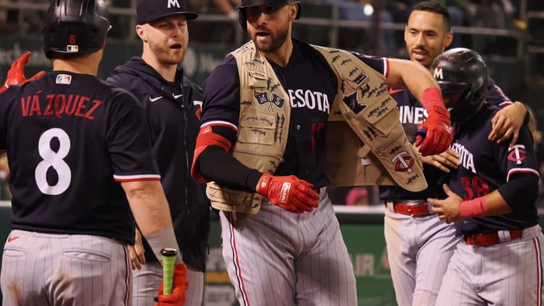 Jul 14, 2023; Oakland, California, USA; Minnesota Twins left fielder Joey Gallo (13) celebrates with teammates after hitting a two-run home run Oakland Athletics during the ninth inning at Oakland-Alameda County Coliseum. Mandatory Credit: Kelley L Cox-USA TODAY Sports