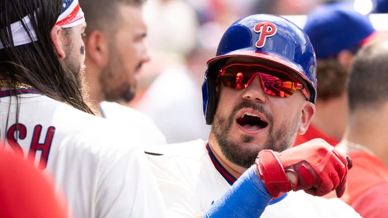 Jul 15, 2023; Philadelphia, Pennsylvania, USA; Philadelphia Phillies left fielder Kyle Schwarber (12) reacts with center fielder Brandon Marsh (16) after hitting a home run during the seventh inning against the San Diego Padres at Citizens Bank Park. Mandatory Credit: Bill Streicher-USA TODAY Sports
