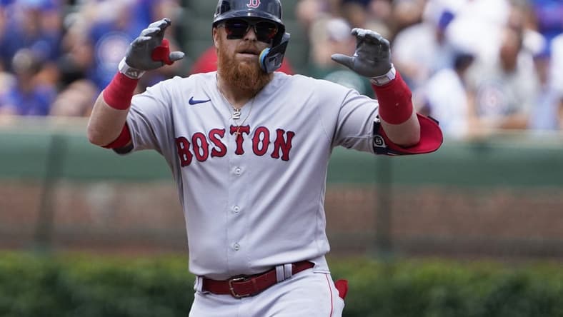 Jul 15, 2023; Chicago, Illinois, USA; Boston Red Sox designated hitter Justin Turner (2) gestures after hitting a double against the Chicago Cubs during the first inning at Wrigley Field. Mandatory Credit: David Banks-USA TODAY Sports