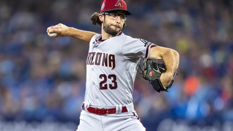Jul 15, 2023; Toronto, Ontario, CAN; Arizona Diamondbacks starting pitcher Zac Gallen (23) pitches to the Toronto Blue Jays during the first inning at Rogers Centre. Mandatory Credit: Kevin Sousa-USA TODAY Sports