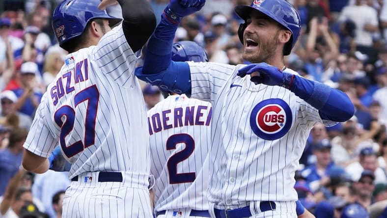Jul 15, 2023; Chicago, Illinois, USA; Chicago Cubs center fielder Cody Bellinger (24) is greeted by right fielder Seiya Suzuki (27) after hitting a grand slam home run against the Boston Red Sox during the third inning at Wrigley Field. Mandatory Credit: David Banks-USA TODAY Sports