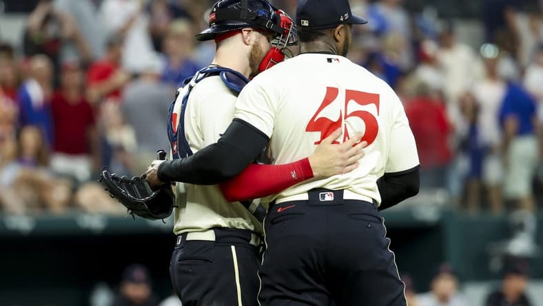 Jul 15, 2023; Arlington, Texas, USA; Texas Rangers relief pitcher Aroldis Chapman (45) and Texas Rangers catcher Jonah Heim (28) celebrate after the game against the Cleveland Guardians at Globe Life Field. Mandatory Credit: Kevin Jairaj-USA TODAY Sports