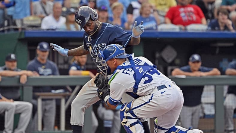 Jul 15, 2023; Kansas City, Missouri, USA;  Kansas City Royals catcher Freddy Fermin (34) tags out Tampa Bay Rays left fielder Randy Arozarena (56) at home plate in the sixth inning at Kauffman Stadium. Mandatory Credit: Peter Aiken-USA TODAY Sports