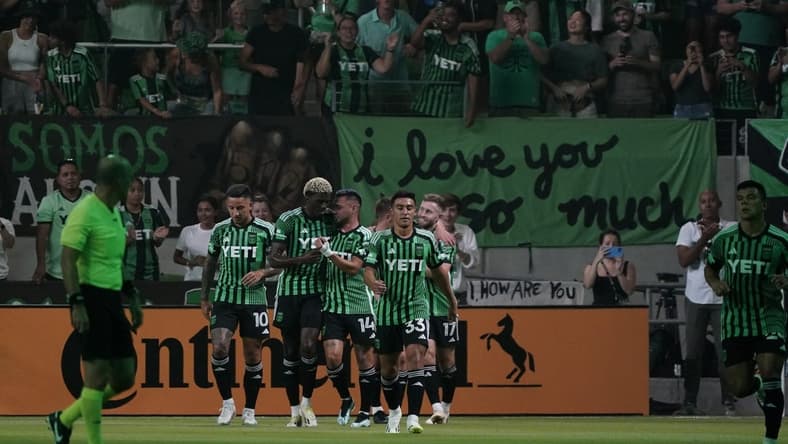 Jul 15, 2023; Austin, Texas, USA; Austin FC midfielder Ethan Finlay (13) celebrates with teammates after scoring a goal against the Sporting Kansas City during the first half at Q2 Stadium. Mandatory Credit: Scott Wachter-USA TODAY Sports