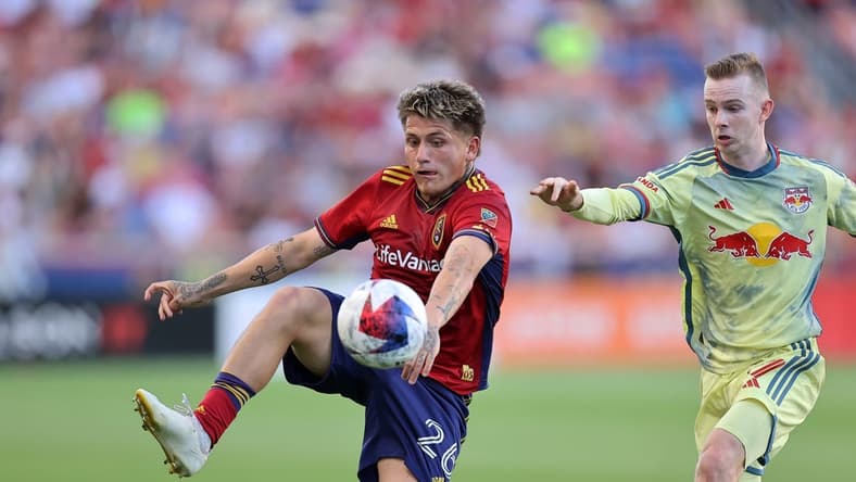 Jul 15, 2023; Sandy, Utah, USA; Real Salt Lake midfielder Diego Luna (26) and New York Red Bulls forward Cameron Harper (17) battle for control of a ball in the first half at America First Field. Mandatory Credit: Rob Gray-USA TODAY Sports