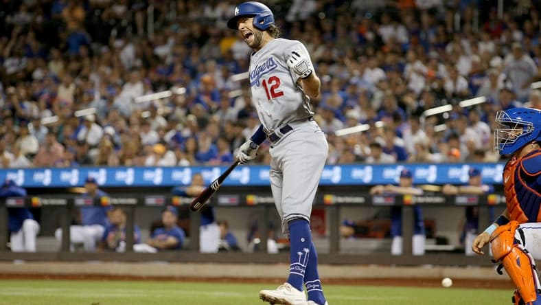 Jul 15, 2023; New York City, New York, USA; Los Angeles Dodgers outfielder Jake Marisnick (12) reacts after being hit by a pitch during the eighth inning against the New York Mets at Citi Field. Mandatory Credit: Brad Penner-USA TODAY Sports