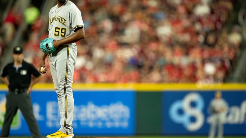 Milwaukee Brewers relief pitcher Elvis Peguero (59) prepares to pitch in the seventh inning of the MLB baseball game between the Cincinnati Reds and the Milwaukee Brewers at Great American Ball Park in Cincinnati on Saturday, July 15, 2023.