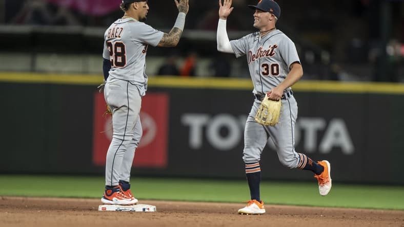 Jul 15, 2023; Seattle, Washington, USA; Detroit Tigers right fielder Kerry Carpenter (30) and shortstop Eugenio Suarez (28) celebrate after a game against the Seattle Mariners at T-Mobile Park. Mandatory Credit: Stephen Brashear-USA TODAY Sports