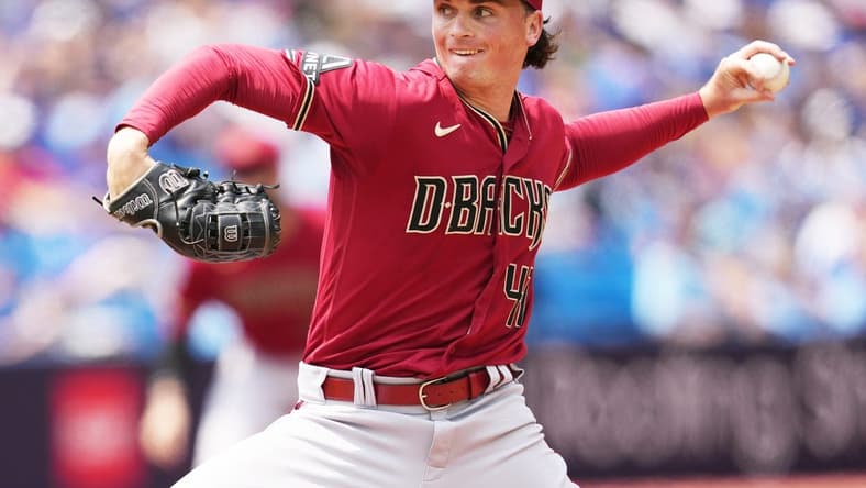 Jul 16, 2023; Toronto, Ontario, CAN; Arizona Diamondbacks starting pitcher Tommy Henry (47) throws pitch against the Toronto Blue Jays during the first inning at Rogers Centre. Mandatory Credit: Nick Turchiaro-USA TODAY Sports