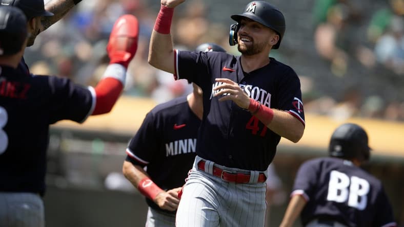 Jul 16, 2023; Oakland, California, USA; Minnesota Twins infielder Edouard Julien (47) celebrates scoring on a three-run double by Alex Kirilloff during the seventh inning against the Oakland Athletics at Oakland-Alameda County Coliseum. Mandatory Credit: D. Ross Cameron-USA TODAY Sports