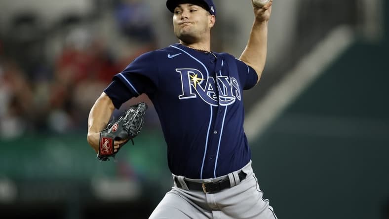 Jul 17, 2023; Arlington, Texas, USA; Tampa Bay Rays starting pitcher Shane McClanahan (18) throws a pitch in the third inning against the Texas Rangers at Globe Life Field. Mandatory Credit: Tim Heitman-USA TODAY Sports
