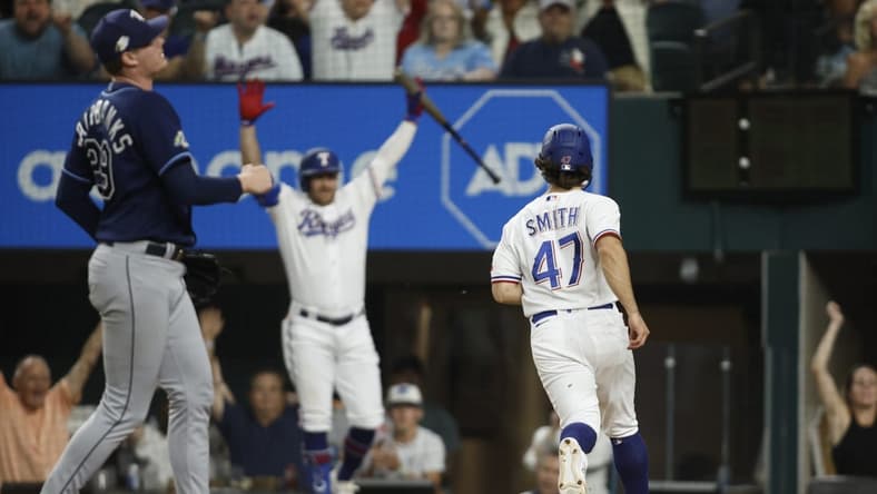 Jul 17, 2023; Arlington, Texas, USA; Texas Rangers shortstop Josh Smith (47) scores the winning run on a wild pitch in the ninth inning against the Tampa Bay Rays at Globe Life Field. Mandatory Credit: Tim Heitman-USA TODAY Sports