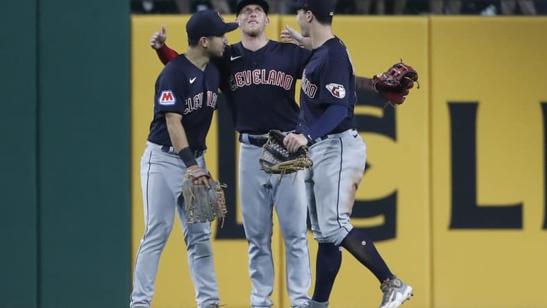 Jul 17, 2023; Pittsburgh, Pennsylvania, USA;  Cleveland Guardians left fielder Steven Kwan (left) and center fielder Myles Straw (middle) and right fielder David Fry (right) celebrate in the outfield after defeating the Pittsburgh Pirates at PNC Park. The Guardians shutout the Pirates 11-0. Mandatory Credit: Charles LeClaire-USA TODAY Sports