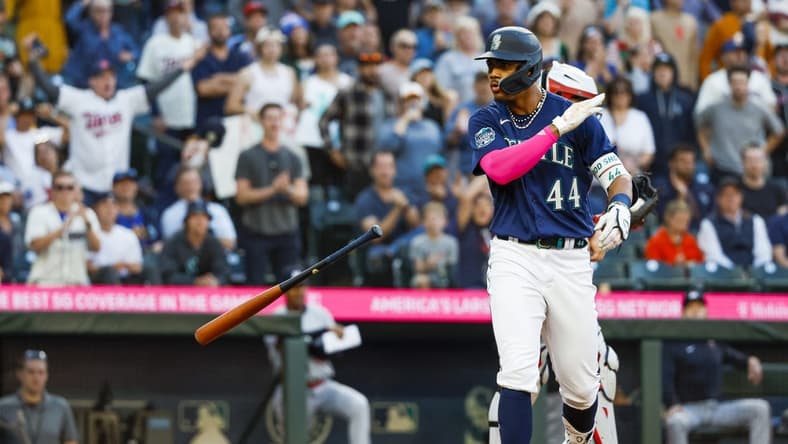 Jul 17, 2023; Seattle, Washington, USA; Seattle Mariners center fielder Julio Rodriguez (44) tosses his bat after drawing an RB-walk against the Minnesota Twins during the fifth inning at T-Mobile Park. Mandatory Credit: Joe Nicholson-USA TODAY Sports