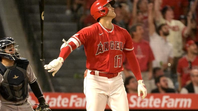 Jul 17, 2023; Anaheim, California, USA;  Los Angeles Angels designated hitter Shohei Ohtani (17) flips his bat after hitting a two-run home run in the seventh inning against the New York Yankees at Angel Stadium. Mandatory Credit: Jayne Kamin-Oncea-USA TODAY Sports