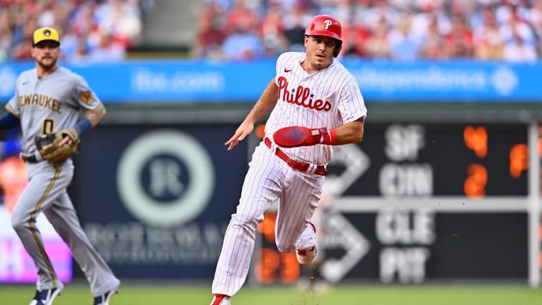 Jul 18, 2023; Philadelphia, Pennsylvania, USA; Philadelphia Phillies catcher J.T. Realmuto (10) advances to third against the Milwaukee Brewers in the second inning at Citizens Bank Park. Mandatory Credit: Kyle Ross-USA TODAY Sports