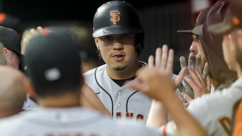 Jul 18, 2023; Cincinnati, Ohio, USA; San Francisco Giants designated hitter Wilmer Flores (41) high fives teammates after hitting a solo home run in the first inning against the Cincinnati Reds at Great American Ball Park. Mandatory Credit: Katie Stratman-USA TODAY Sports