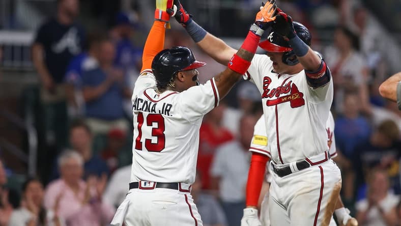Jul 18, 2023; Atlanta, Georgia, USA; Atlanta Braves third baseman Austin Riley (27) celebrates after a two-run home run with right fielder Ronald Acuna Jr. (13) against the Arizona Diamondbacks in the sixth inning at Truist Park. Mandatory Credit: Brett Davis-USA TODAY Sports