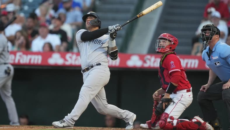 Jul 18, 2023; Anaheim, California, USA; New York Yankees second baseman Gleyber Torres (25) hits a home run in the second inning against the Los Angeles Angels at Angel Stadium. Mandatory Credit: Kirby Lee-USA TODAY Sports