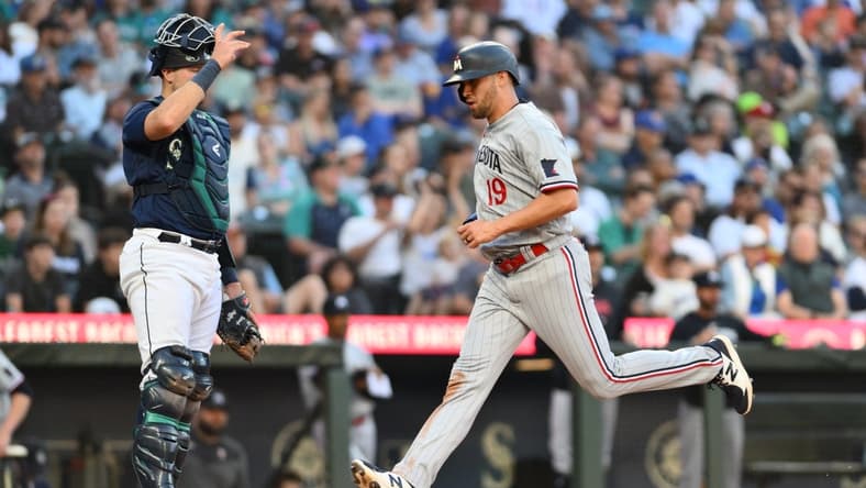 Jul 18, 2023; Seattle, Washington, USA; Minnesota Twins first baseman Alex Kirilloff (19) scores a run off a double hit by right fielder Max Kepler (26) (not pictured) during the fourth inning against the Seattle Mariners at T-Mobile Park. Mandatory Credit: Steven Bisig-USA TODAY Sports