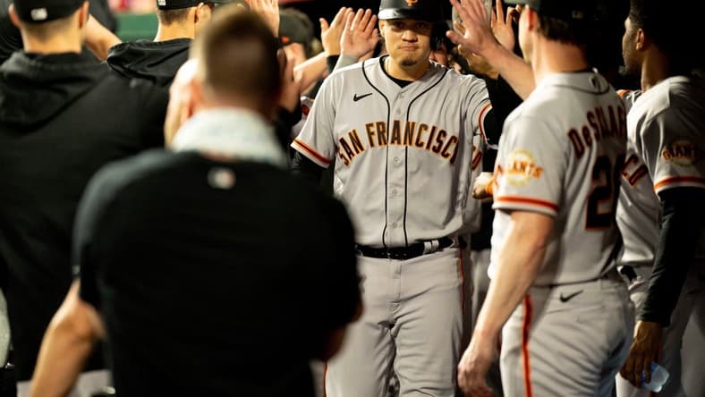 San Francisco Giants first baseman Wilmer Flores (41) celebrates with teammates after hitting a game tying 3-run home run in the third inning of the MLB baseball game between the Cincinnati Reds and San Francisco Giants at Great American Ball Park in Cincinnati on Tuesday, July 18, 2023.