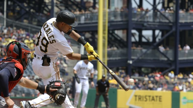 Jul 19, 2023; Pittsburgh, Pennsylvania, USA; Pittsburgh Pirates second baseman Nick Gonzales (39) hits an RBI single against the Cleveland Guardians during the fifth inning at PNC Park. Mandatory Credit: Charles LeClaire-USA TODAY Sports