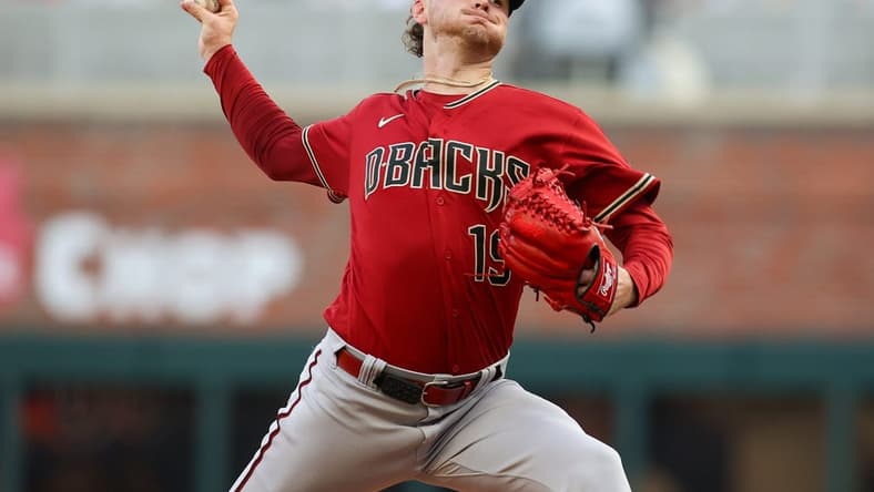 Jul 19, 2023; Atlanta, Georgia, USA; Arizona Diamondbacks starting pitcher Ryne Nelson (19) throws against the Atlanta Braves in the first inning at Truist Park. Mandatory Credit: Brett Davis-USA TODAY Sports