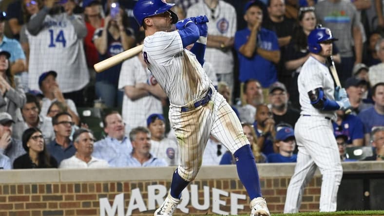 Jul 19, 2023; Chicago, Illinois, USA; Chicago Cubs second baseman Nico Hoerner (2) his a grand slam against the Washington Nationals during the eighth inning at Wrigley Field. Mandatory Credit: Matt Marton-USA TODAY Sports