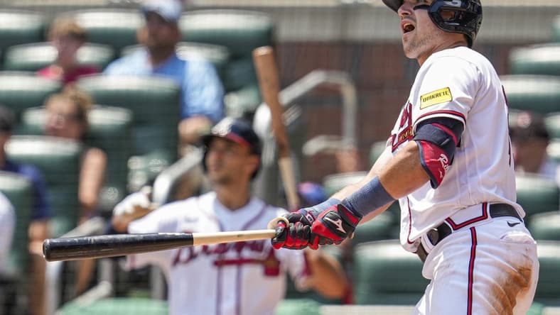 Jul 20, 2023; Cumberland, Georgia, USA; Atlanta Braves third baseman Austin Riley (27) reacts after hitting a home run against the Arizona Diamondbacks during the eighth inning at Truist Park. Mandatory Credit: Dale Zanine-USA TODAY Sports