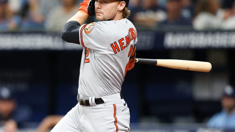 Jul 20, 2023; St. Petersburg, Florida, USA; Baltimore Orioles third baseman Gunnar Henderson (2) doubles against the Tampa Bay Rays in the fourth inning at Tropicana Field. Mandatory Credit: Nathan Ray Seebeck-USA TODAY Sports