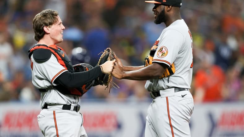 Jul 20, 2023; St. Petersburg, Florida, USA; Baltimore Orioles catcher Adley Rutschman (35) and relief pitcher Felix Bautista (74) celebrate after beating the Tampa Bay Rays in eleventh innings at Tropicana Field. Mandatory Credit: Nathan Ray Seebeck-USA TODAY Sports