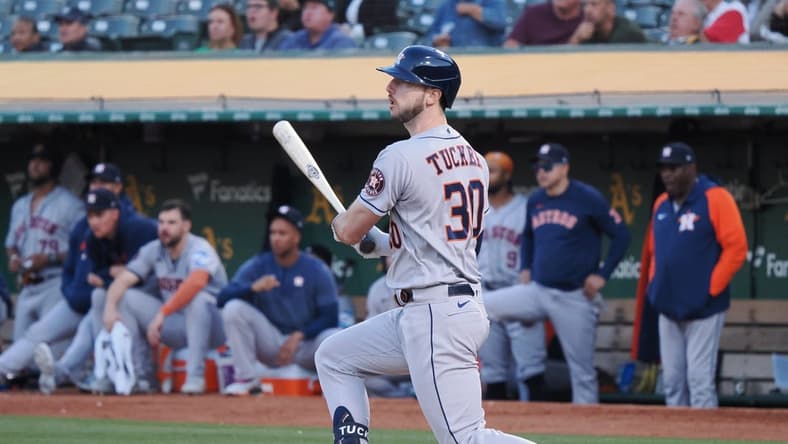 Jul 20, 2023; Oakland, California, USA; Houston Astros right fielder Kyle Tucker (30) hits a two-run double against the Oakland Athletics during the sixth inning at Oakland-Alameda County Coliseum. Mandatory Credit: Kelley L Cox-USA TODAY Sports